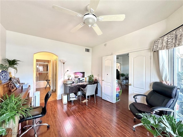 7400 W Flamingo Rd Unit 1094, Las Vegas, NV 89147 - office area featuring arched walkways, ceiling fan, and wood finished floors