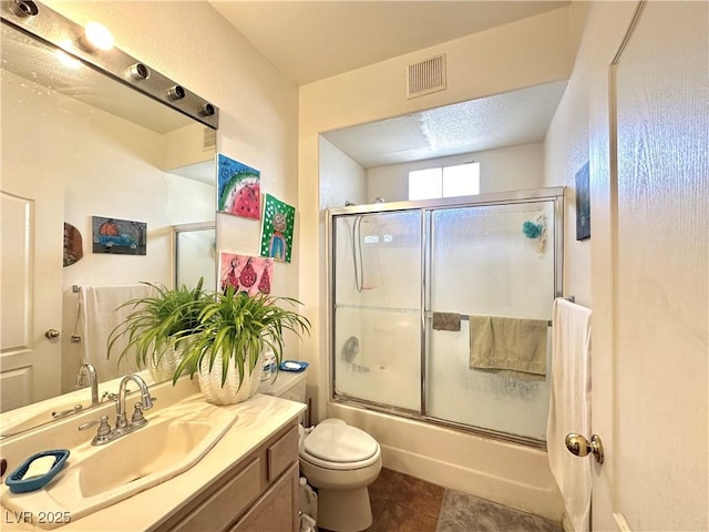 7400 W Flamingo Rd Unit 1094, Las Vegas, NV 89147 - bathroom featuring vanity, combined bath / shower with glass door, and tile patterned flooring