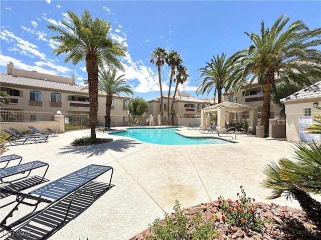 7400 W Flamingo Rd Unit 1094, Las Vegas, NV 89147 - community pool featuring a patio area and a residential view