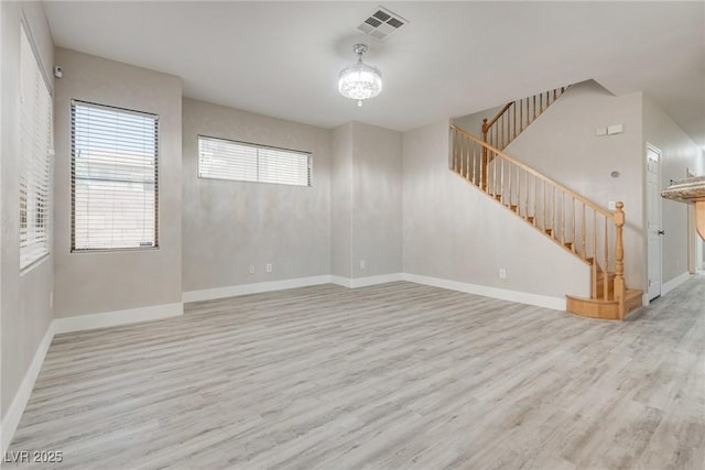 8021 Dancing Springs St, Las Vegas, NV 89143 - unfurnished room featuring wood finished floors, stairs, and a chandelier