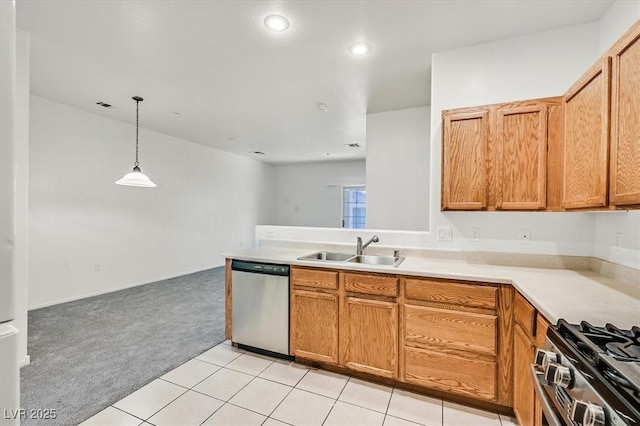 5960 Palmilla St Unit 7, North Las Vegas, NV 89031 - kitchen featuring appliances with stainless steel finishes, light carpet, light countertops, recessed lighting, and pendant lighting