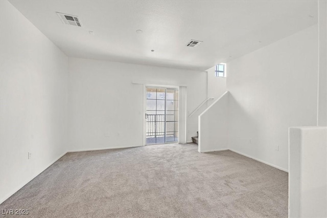 5960 Palmilla St Unit 7, North Las Vegas, NV 89031 - unfurnished room featuring carpet floors and stairway