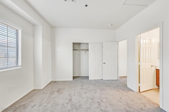 5960 Palmilla St Unit 7, North Las Vegas, NV 89031 - unfurnished bedroom featuring carpet floors and a closet