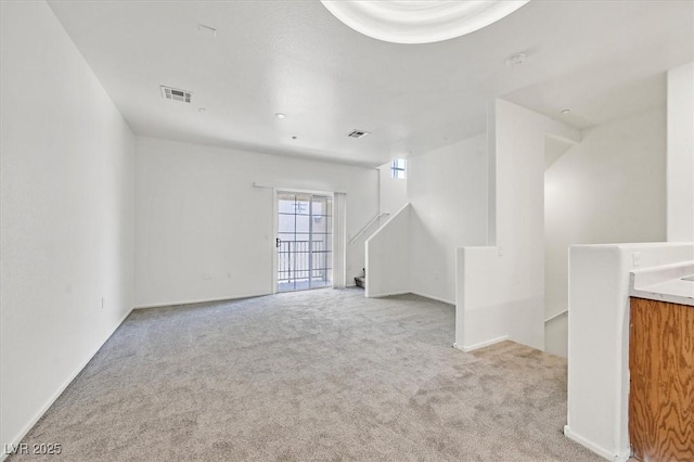 5960 Palmilla St Unit 7, North Las Vegas, NV 89031 - unfurnished living room featuring carpet flooring