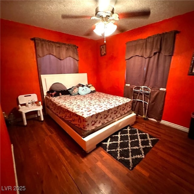 2709 Carroll St, North Las Vegas, NV 89030 - bedroom featuring dark wood-style floors, a textured ceiling, and ceiling fan