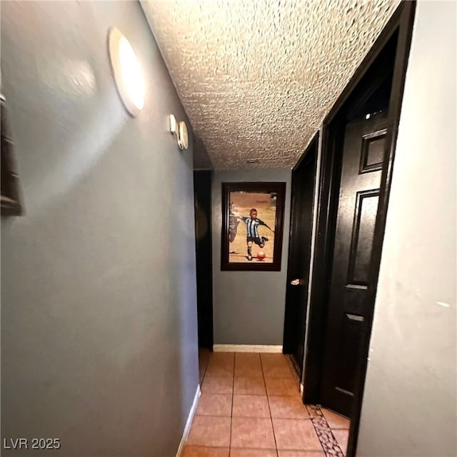 2709 Carroll St, North Las Vegas, NV 89030 - hall with light tile patterned floors and a textured ceiling