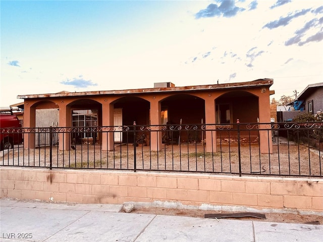 2709 Carroll St, North Las Vegas, NV 89030 - view of front of home featuring a fenced front yard and stucco siding