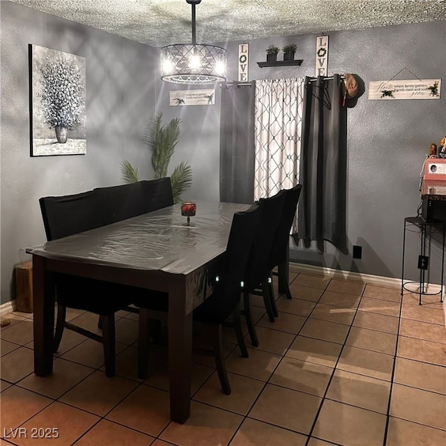 2709 Carroll St, North Las Vegas, NV 89030 - dining room with tile patterned floors, a textured ceiling, and a textured wall