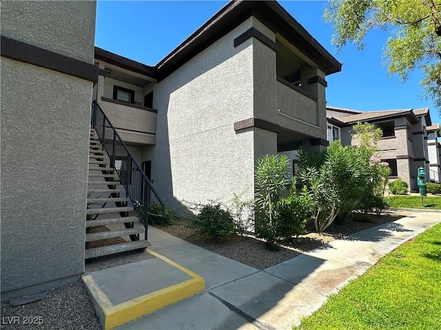 45 Maleena Mesa St Unit 211, Henderson, NV 89074 - view of property exterior featuring stucco siding and stairway