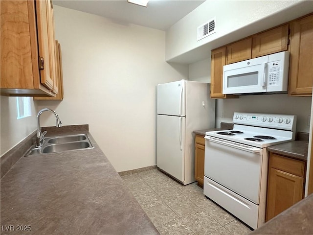45 Maleena Mesa St Unit 211, Henderson, NV 89074 - kitchen featuring white appliances and a sink