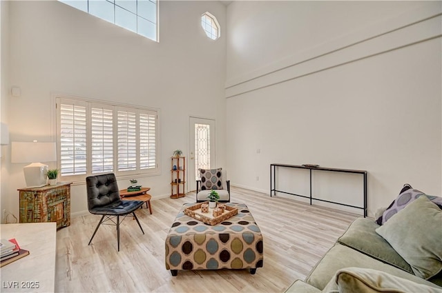 10921 Calcedonian St, Las Vegas, NV 89141 - living room featuring a high ceiling and wood finished floors