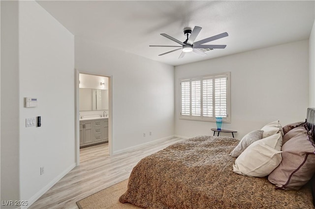 10921 Calcedonian St, Las Vegas, NV 89141 - bedroom featuring light wood-style flooring, connected bathroom, and a ceiling fan