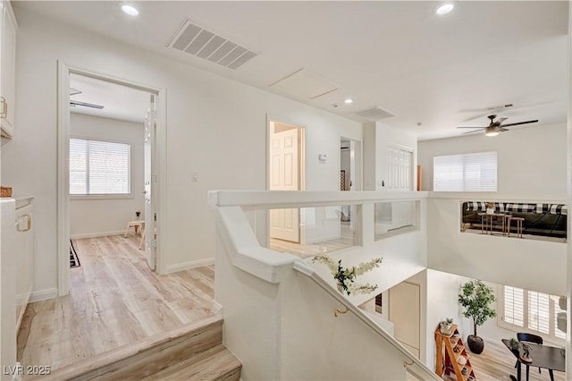 10921 Calcedonian St, Las Vegas, NV 89141 - hall with healthy amount of natural light, light wood finished floors, recessed lighting, and an upstairs landing
