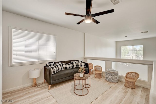 10921 Calcedonian St, Las Vegas, NV 89141 - living room with a ceiling fan and wood finished floors