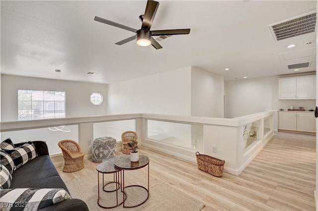 10921 Calcedonian St, Las Vegas, NV 89141 - living room featuring light wood-style floors, a ceiling fan, and recessed lighting