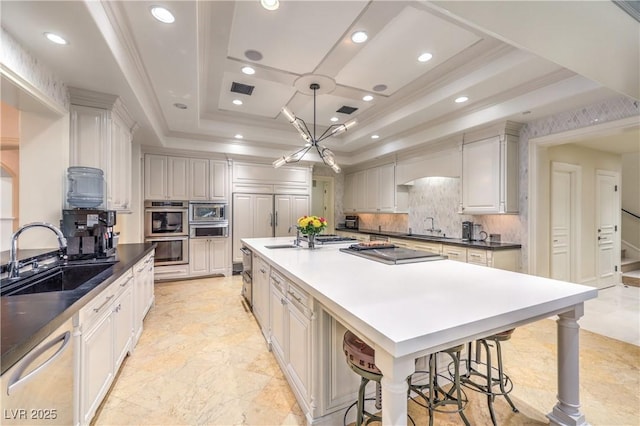 30 Augusta Canyon Way, Las Vegas, NV 89141 - kitchen with appliances with stainless steel finishes, recessed lighting, a warming drawer, tasteful backsplash, and a spacious island