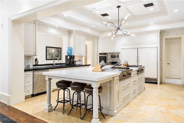 30 Augusta Canyon Way, Las Vegas, NV 89141 - kitchen with appliances with stainless steel finishes, a chandelier, a kitchen island with sink, a kitchen breakfast bar, and recessed lighting