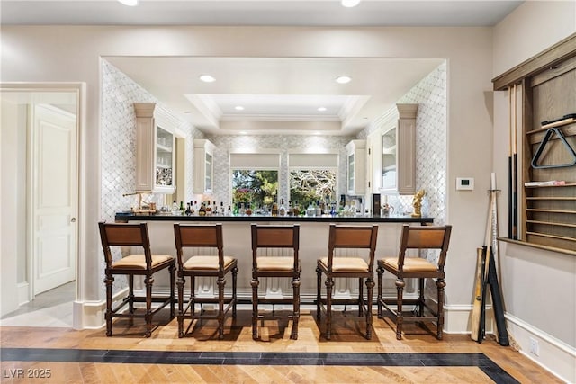 30 Augusta Canyon Way, Las Vegas, NV 89141 - indoor dry bar with crown molding, tasteful backsplash, and light wood-style floors