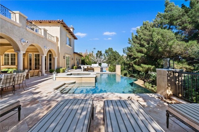 30 Augusta Canyon Way, Las Vegas, NV 89141 - view of pool featuring a patio area, french doors, outdoor dining space, and a pool with connected hot tub