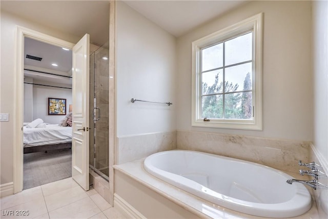 30 Augusta Canyon Way, Las Vegas, NV 89141 - bathroom featuring a shower stall, a garden tub, tile patterned flooring, and ensuite bath