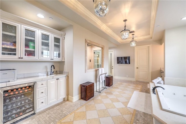 30 Augusta Canyon Way, Las Vegas, NV 89141 - bar area with wine cooler, a raised ceiling, decorative light fixtures, recessed lighting, and crown molding