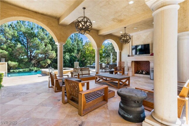 30 Augusta Canyon Way, Las Vegas, NV 89141 - view of patio / terrace with an outdoor pool and an outdoor living space with a fireplace