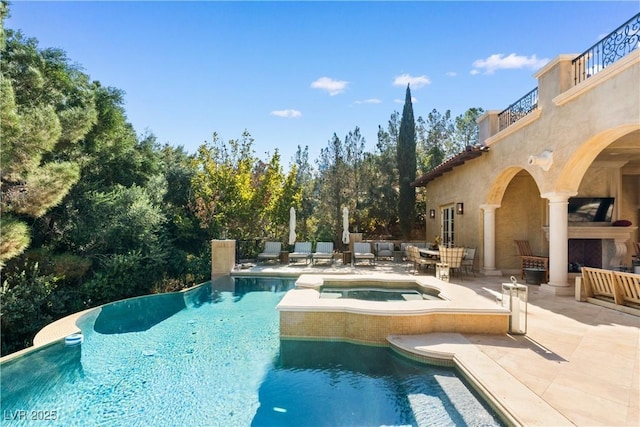30 Augusta Canyon Way, Las Vegas, NV 89141 - view of swimming pool with a patio area, an outdoor hangout area, a pool with connected hot tub, and view of wooded area