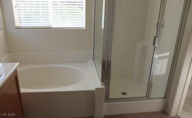 3711 Lodina Ct, Las Vegas, NV 89141 - bathroom featuring vanity, a shower stall, and a garden tub