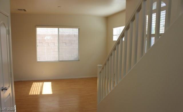 3711 Lodina Ct, Las Vegas, NV 89141 - staircase with wood finished floors and baseboards