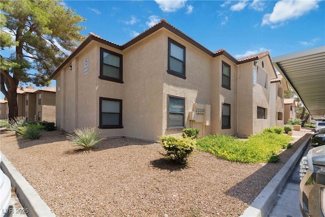 2451 N Rainbow Blvd Unit 1091, Las Vegas, NV 89108 - view of front facade featuring stucco siding and a tile roof