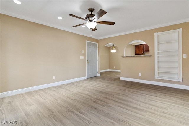 2451 N Rainbow Blvd Unit 1091, Las Vegas, NV 89108 - spare room featuring a ceiling fan, recessed lighting, ornamental molding, light wood finished floors, and arched walkways