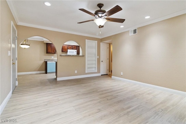 2451 N Rainbow Blvd Unit 1091, Las Vegas, NV 89108 - unfurnished living room with arched walkways, ceiling fan, light wood-style flooring, ornamental molding, and recessed lighting