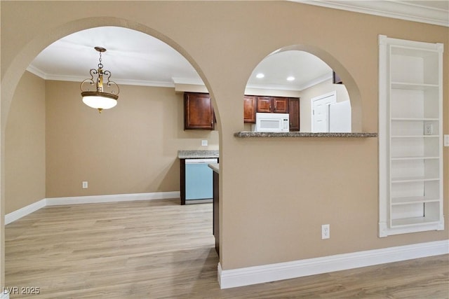 2451 N Rainbow Blvd Unit 1091, Las Vegas, NV 89108 - kitchen featuring white appliances, light wood-type flooring, crown molding, arched walkways, and decorative light fixtures