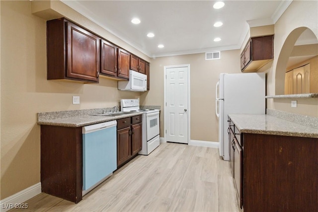 2451 N Rainbow Blvd Unit 1091, Las Vegas, NV 89108 - kitchen featuring white appliances, light wood-style flooring, recessed lighting, crown molding, and dark brown cabinets