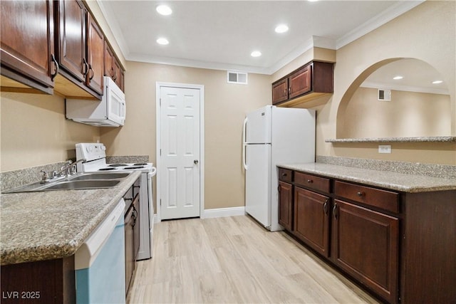 2451 N Rainbow Blvd Unit 1091, Las Vegas, NV 89108 - kitchen with white appliances, ornamental molding, light wood finished floors, recessed lighting, and light countertops