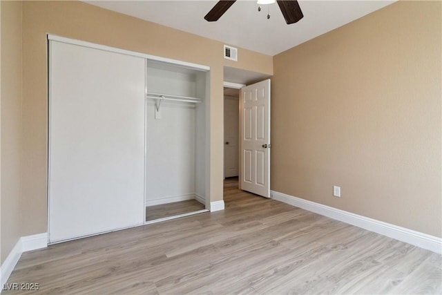 2451 N Rainbow Blvd Unit 1091, Las Vegas, NV 89108 - unfurnished bedroom with wood finished floors, a closet, and a ceiling fan