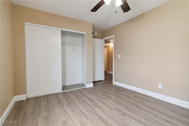 2451 N Rainbow Blvd Unit 1091, Las Vegas, NV 89108 - unfurnished bedroom featuring light wood-style flooring, a closet, and a ceiling fan