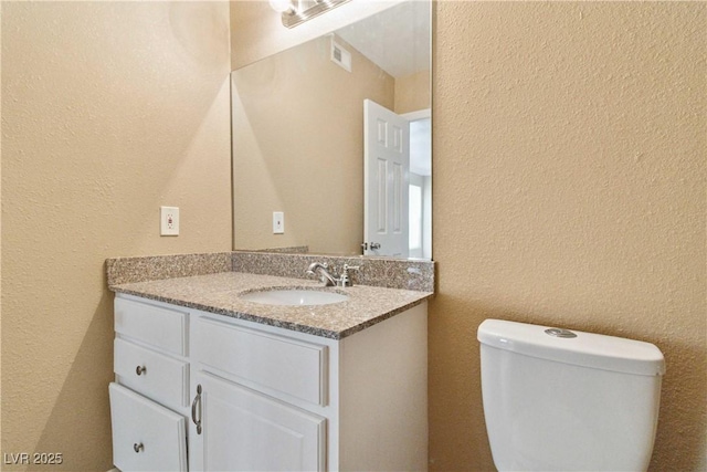 2451 N Rainbow Blvd Unit 1091, Las Vegas, NV 89108 - bathroom with vanity and a textured wall