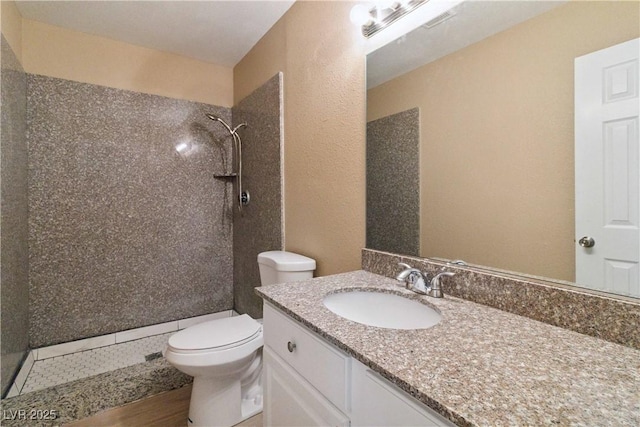 2451 N Rainbow Blvd Unit 1091, Las Vegas, NV 89108 - full bath with tiled shower, vanity, and a textured wall