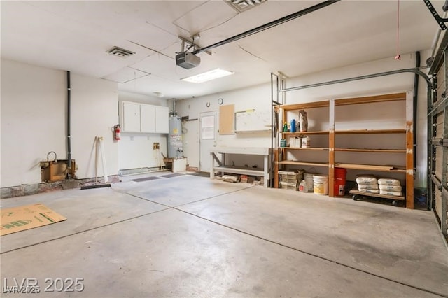 2486 Sabado St, Las Vegas, NV 89121 - garage featuring a garage door opener and electric water heater