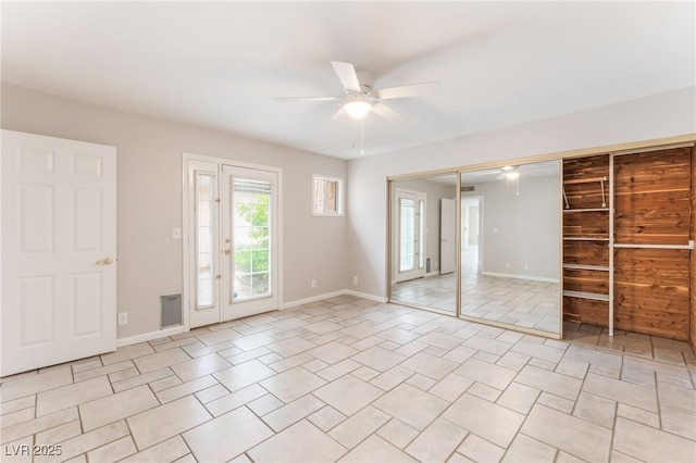 2486 Sabado St, Las Vegas, NV 89121 - unfurnished bedroom featuring light tile patterned flooring, access to outside, a ceiling fan, and a closet