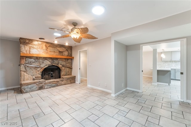 2486 Sabado St, Las Vegas, NV 89121 - unfurnished living room featuring a fireplace, a ceiling fan, and light tile patterned flooring