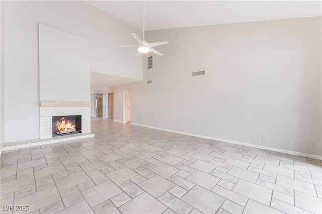 2486 Sabado St, Las Vegas, NV 89121 - unfurnished living room with high vaulted ceiling, a ceiling fan, and a brick fireplace