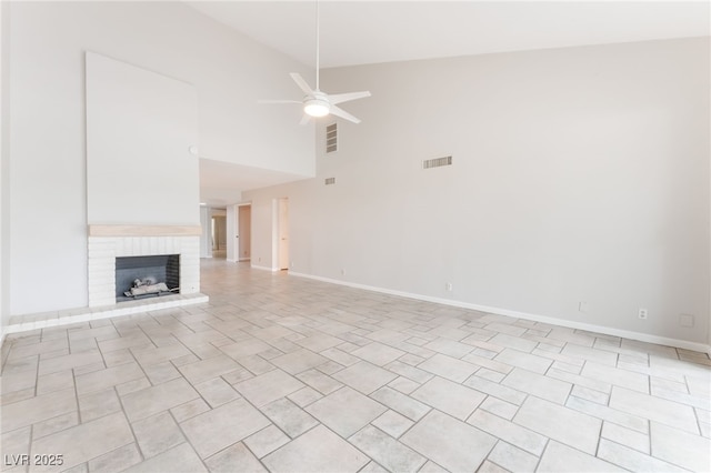 2486 Sabado St, Las Vegas, NV 89121 - unfurnished living room with high vaulted ceiling, a ceiling fan, and a brick fireplace