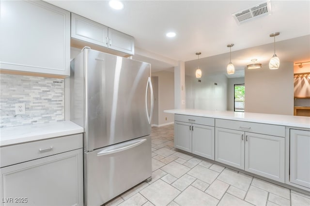 2486 Sabado St, Las Vegas, NV 89121 - kitchen featuring freestanding refrigerator, gray cabinetry, decorative backsplash, light countertops, and recessed lighting