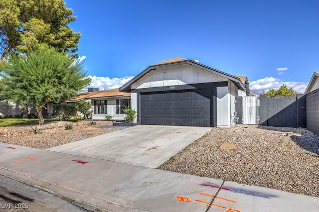3425 Irv Marcus Dr, Las Vegas, NV 89108 - ranch-style house with a garage, concrete driveway, and a gate