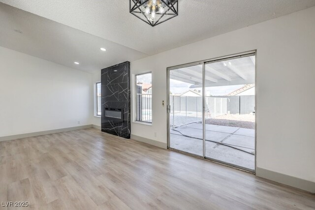 3425 Irv Marcus Dr, Las Vegas, NV 89108 - unfurnished living room with wood finished floors and recessed lighting