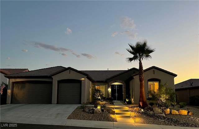 2257 Turner Falls St, Henderson, NV 89044 - view of front of property with a garage, stucco siding, and driveway
