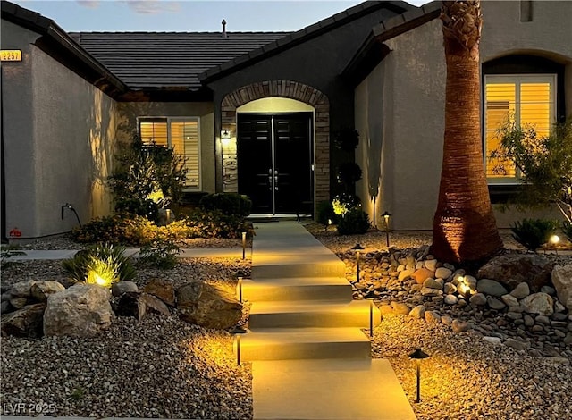 2257 Turner Falls St, Henderson, NV 89044 - property entrance with french doors, stucco siding, and a tile roof