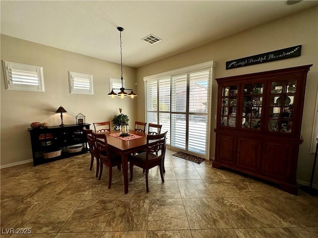 2257 Turner Falls St, Henderson, NV 89044 - dining area with a chandelier and baseboards